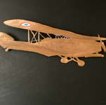 Avion en cuivre découpé